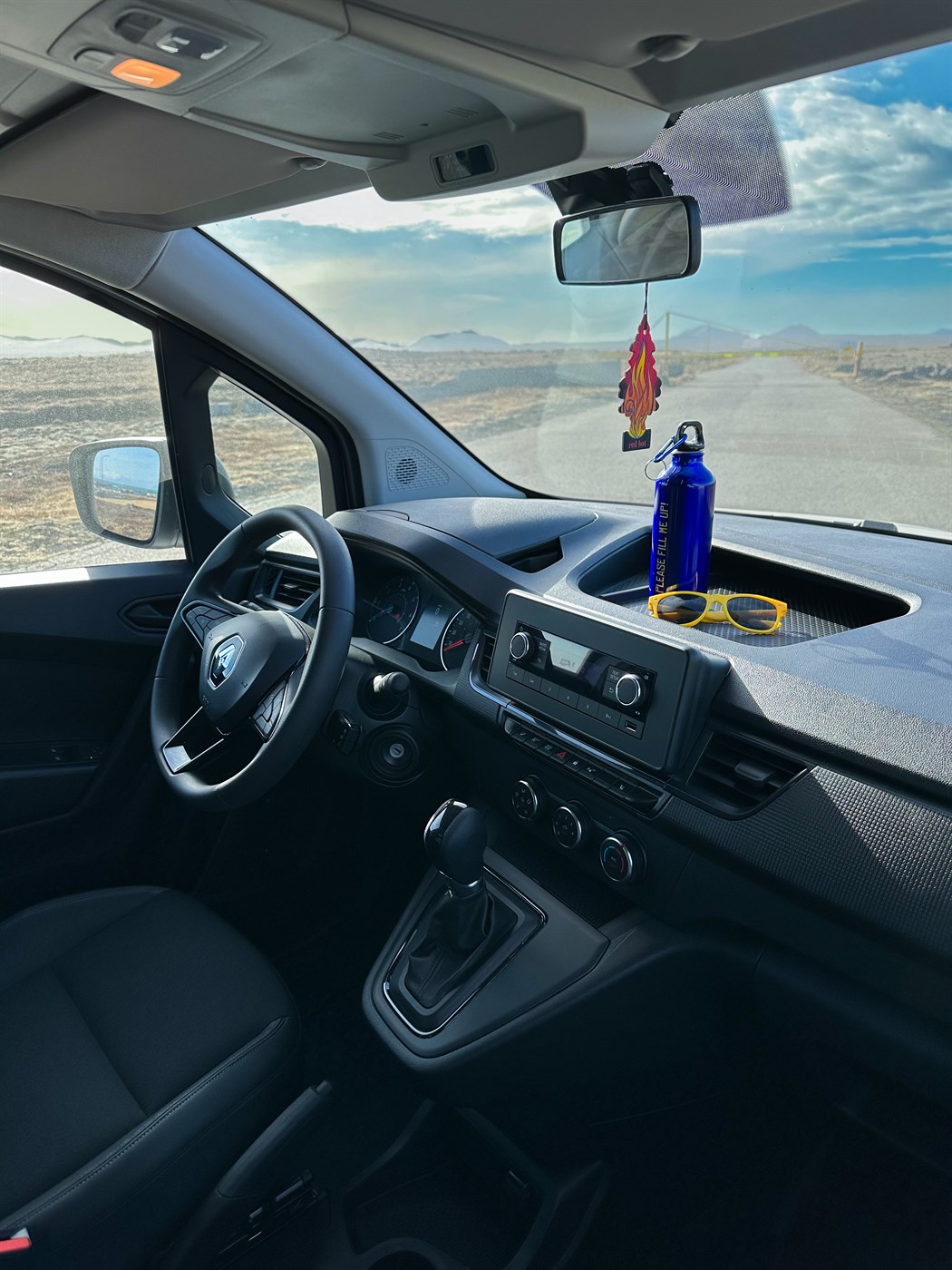 Interior of a campervan driving through Iceland landscapes, showing what daily driving actually feels like