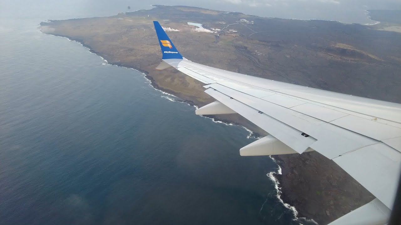 Aerial view of Iceland from a plane window, the moment your road trip stops being an idea.