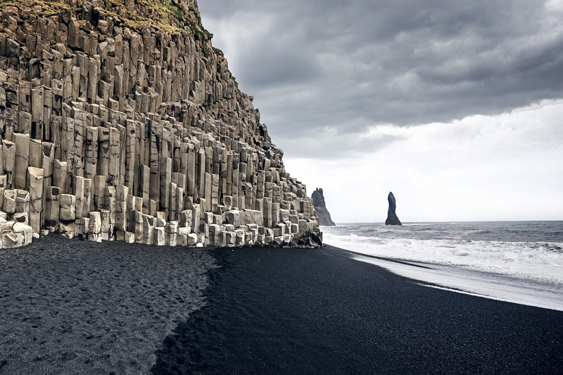 Reynisfjara black sand beach with basalt columns, where everything looks unreal.