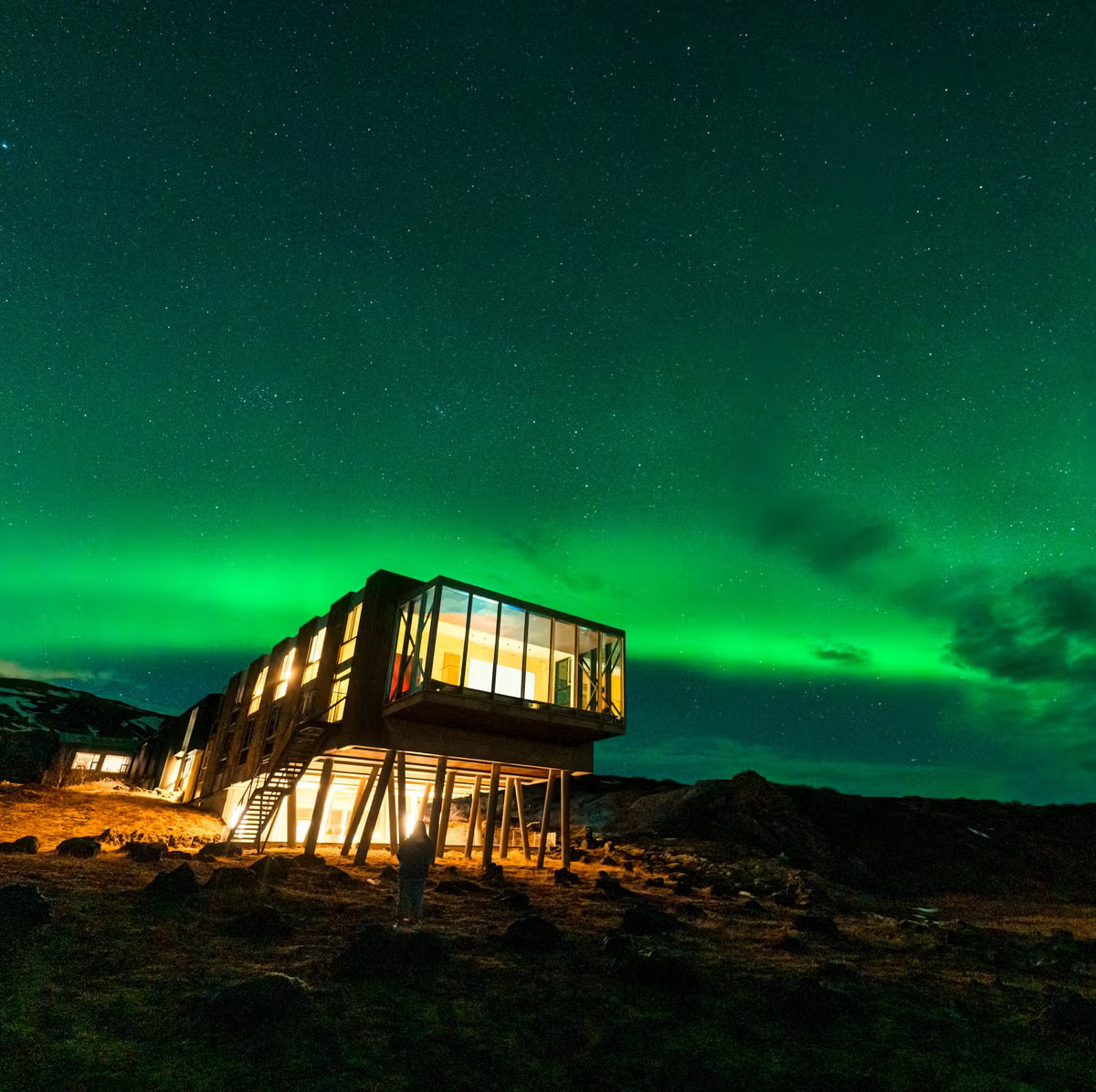 Modern Iceland hotel under the northern lights, perfect for travelers choosing comfort and winter accommodation in Iceland.