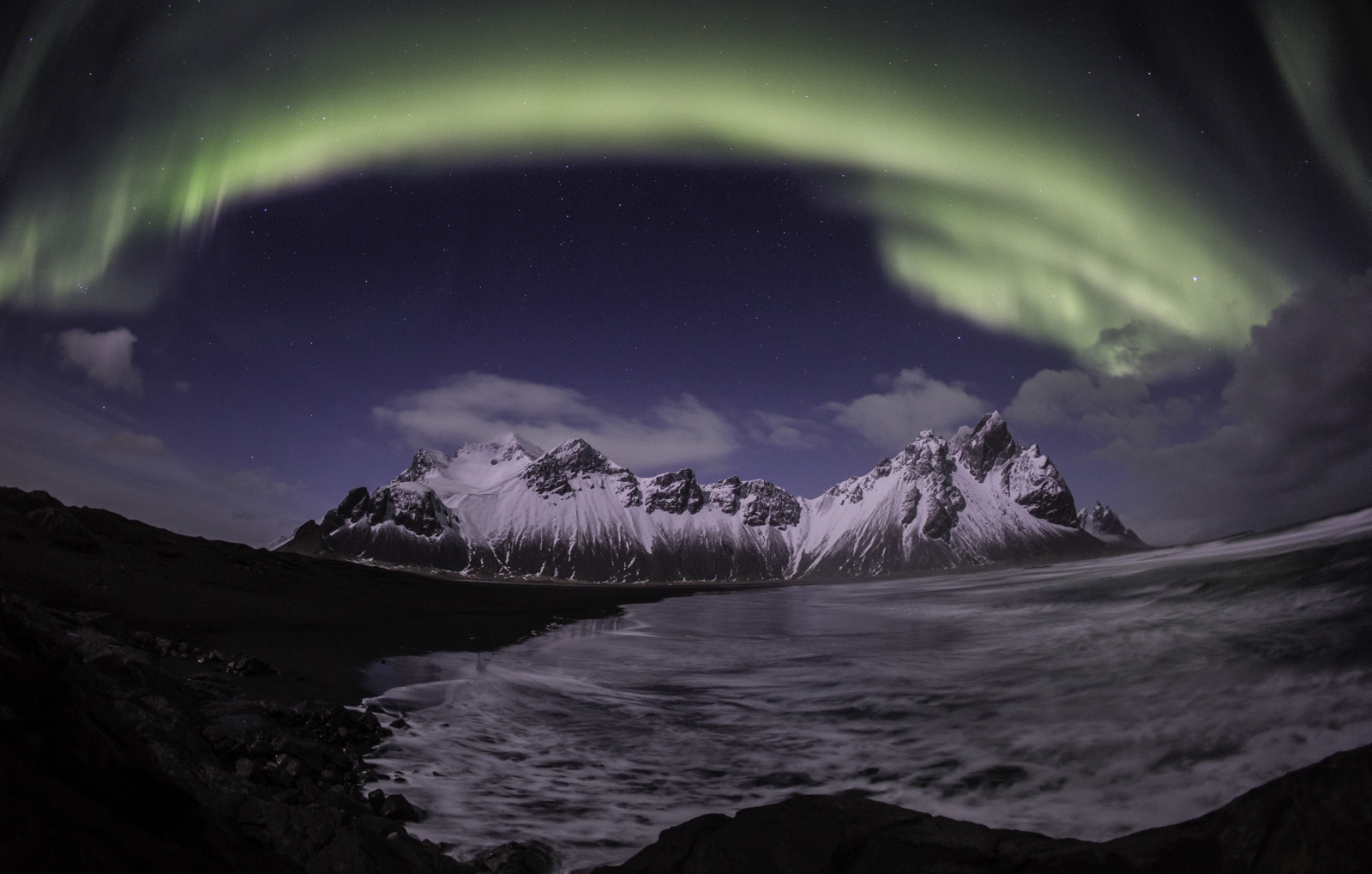 Northern lights in Iceland over mountains