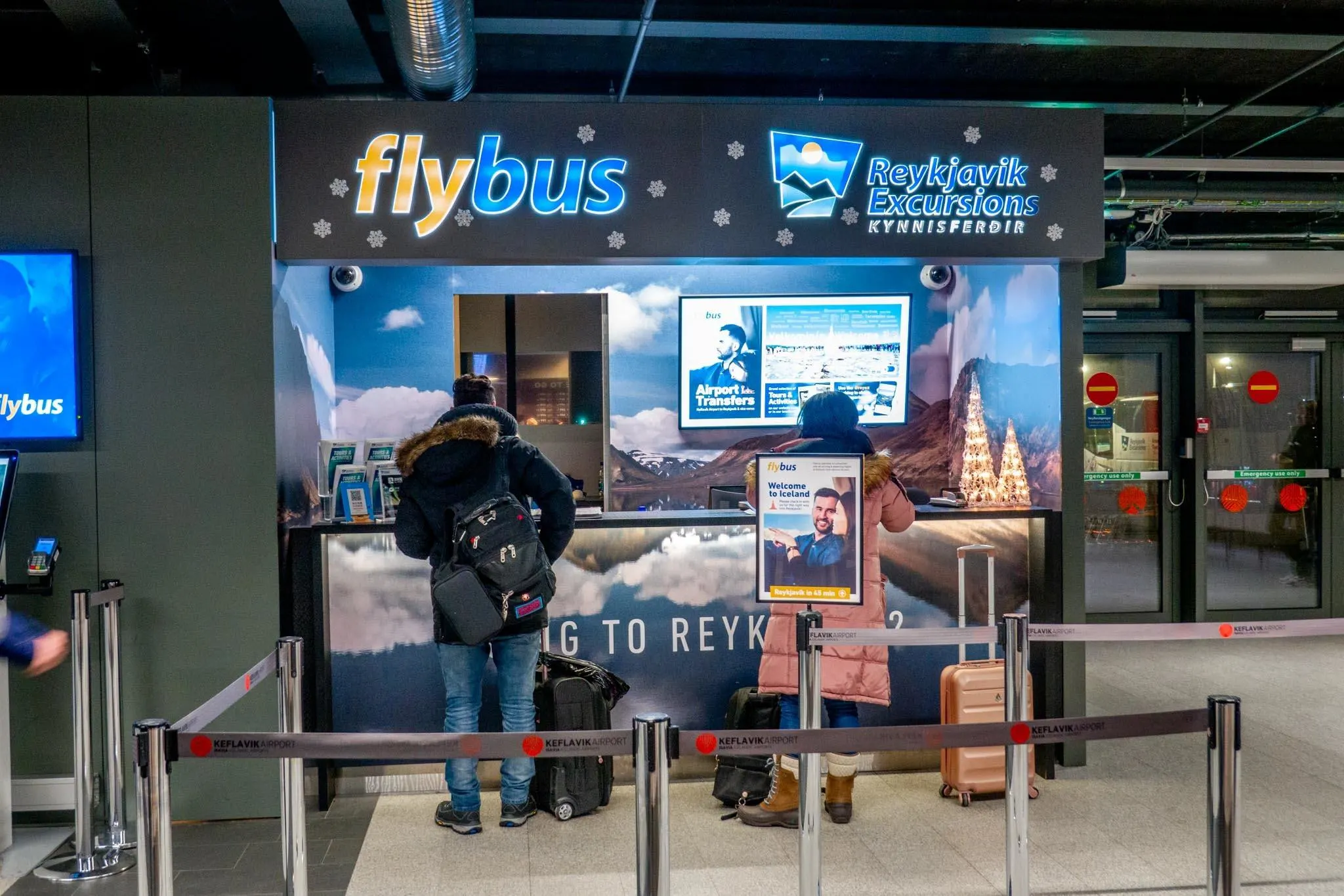 Flybus? Nope. You're waiting for the KuKu squad. The Flybus counter at Keflavík Airport – not your ride, but a good landmark to spot while waiting
