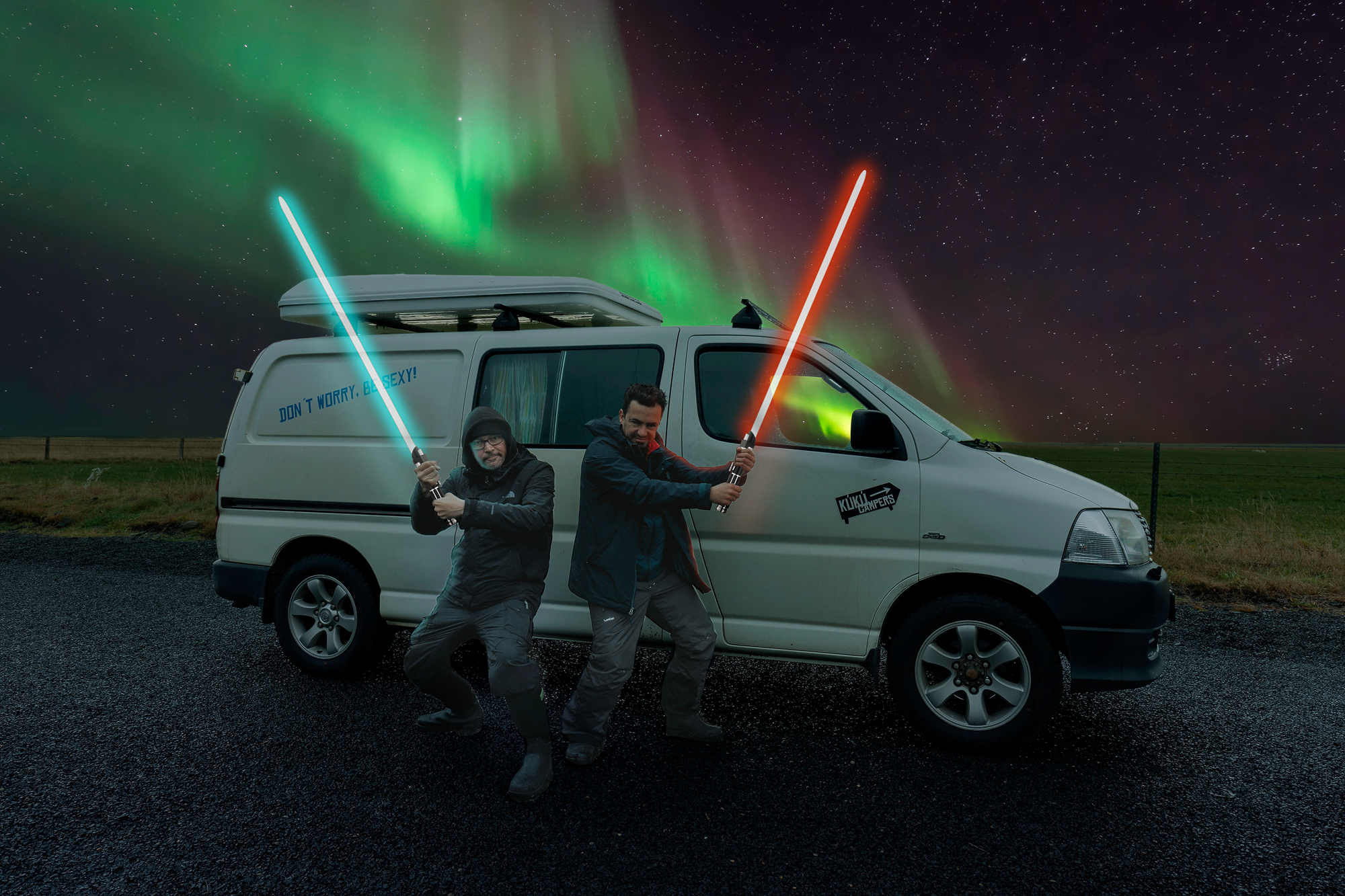 Campervan parked under northern lights in Iceland, capturing the freedom of a roadtrip with no toll roads to worry about