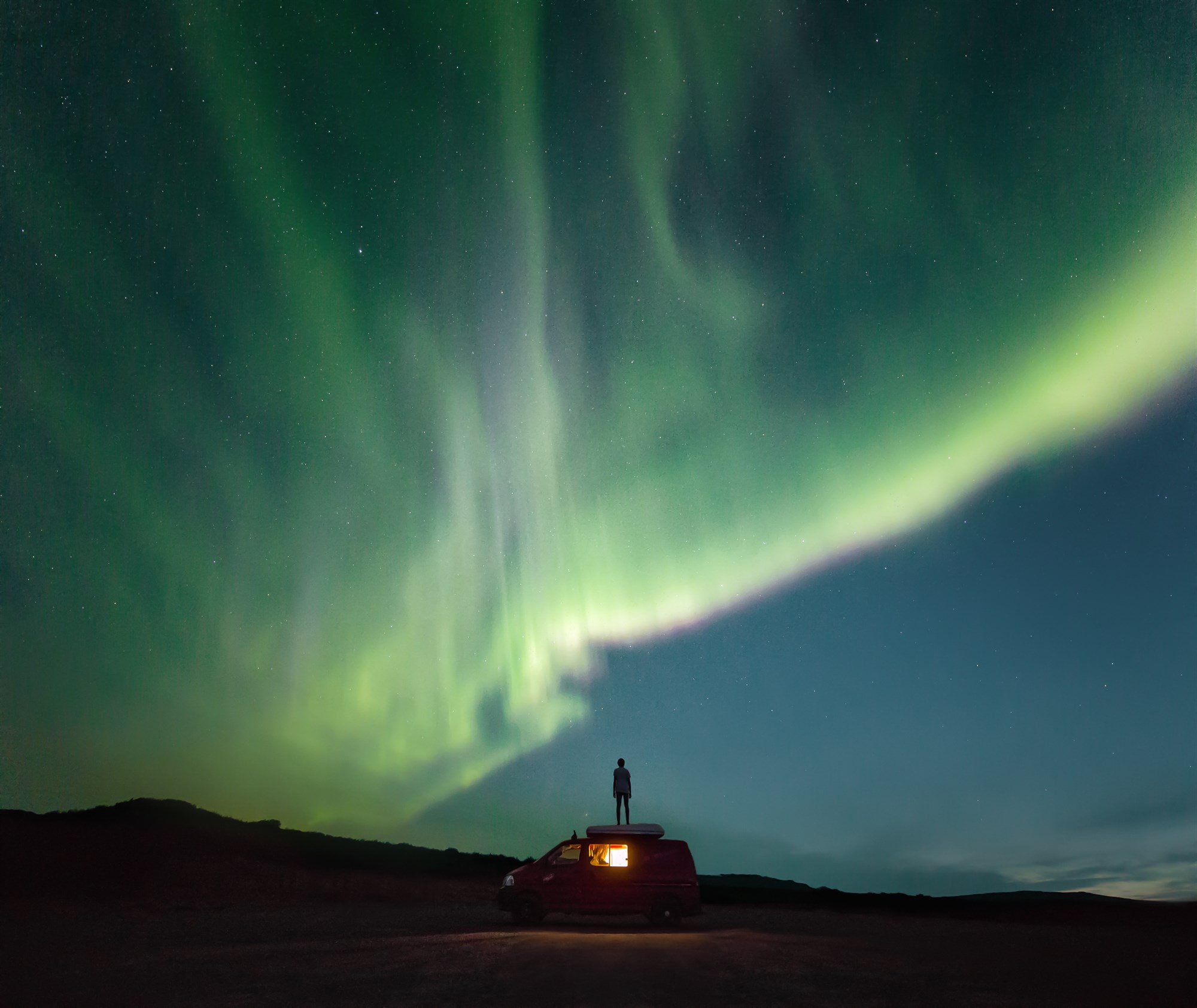 Campervan and northern lights in Iceland